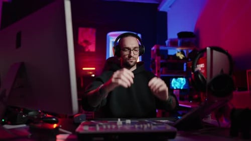 Hacker Writing Code Cracking Computer Man Programmer in Hoodie Cracks System Using Computer in Dark