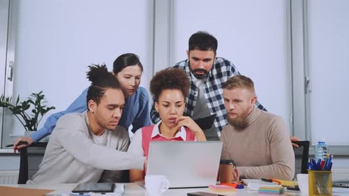 Stressed Team Receiving Bad News in Office