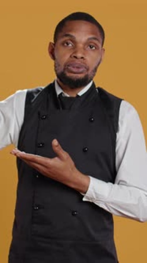 Vertical Video Friendly Restaurant Staff Indicating Direction to Left or Right Sides