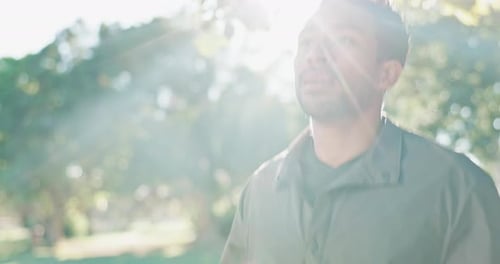 Young Adult Running in Park on Sunny Day