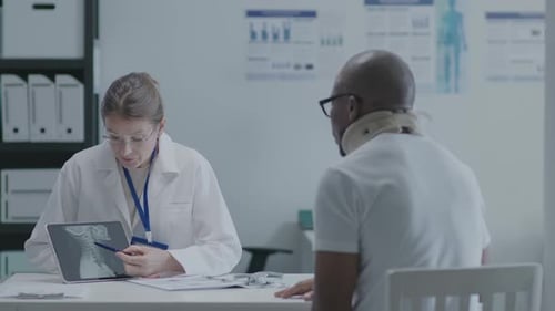 Doctor Explains Neck X-Ray to Patient
