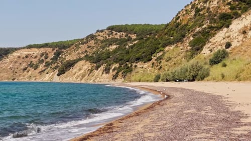 Cinematic sea and ocean waves glide across the sand
