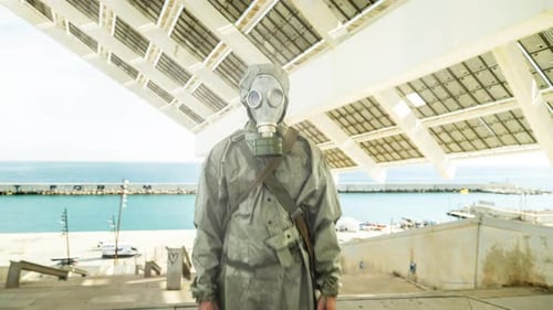 Figure in Hazmat Suit Wearing Gas Mask