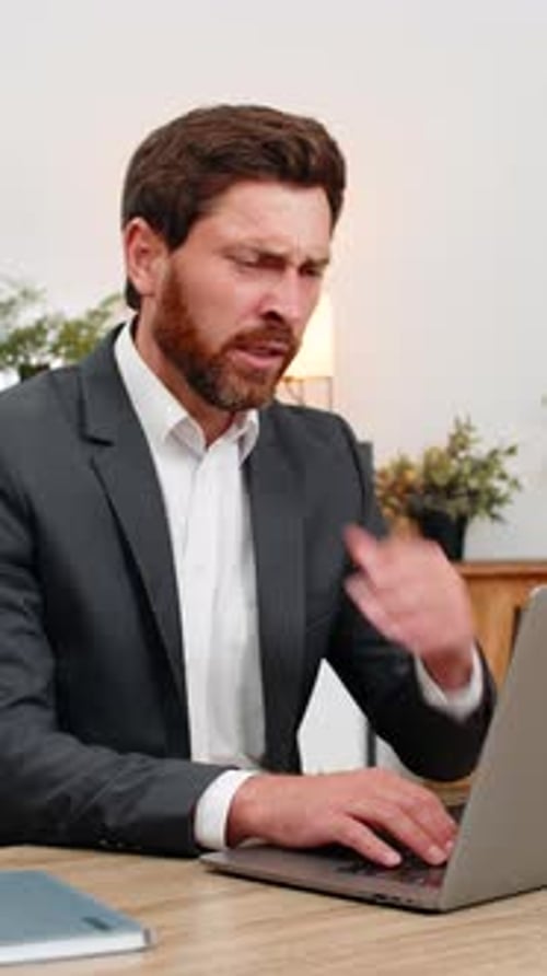 Tired Businessman Working on Laptop Falling Asleep