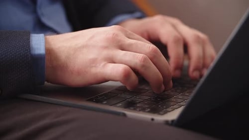 Closeup Male Hands Typing On Notebook Keyboard At Home Office. Close Up Business Man Working On L...