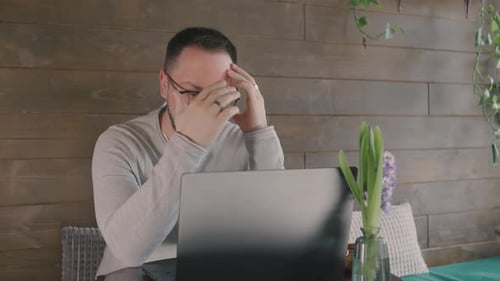 Adult Man Working on Laptop at Home