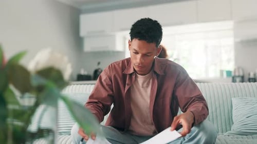 Financial paperwork, reading and man with notebook, receipt and budget in home