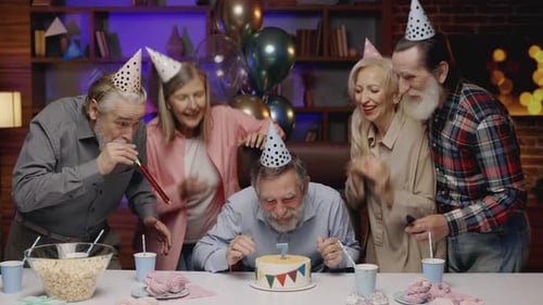 Group of Friends Celebrate Birthday Together Indoors