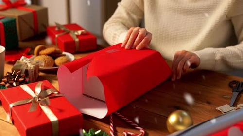 Wrapping Christmas Presents at Home with Festive Decorations