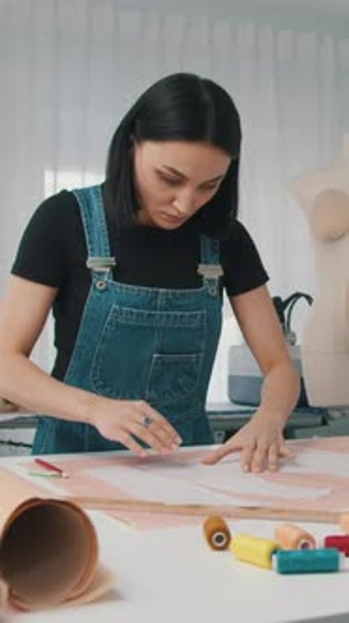 Woman Drawing Fashion Design Pattern in Bright Studio