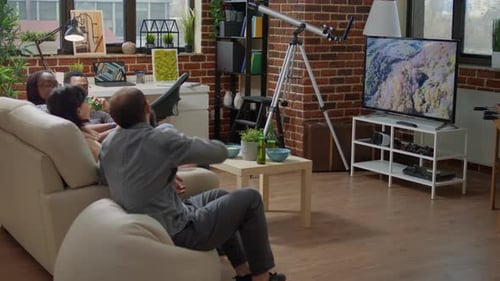 Friends Relaxing Together Watching Television Indoors