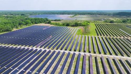 View From Above of Photovoltaic Power Plant with Many Rows of Solar Panels for Producing Clean