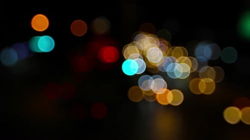 Dynamic Colorful Bokeh Lights on Dark Background