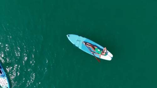 Aerial View Paddleboarding Fun in the Green Canyon People Relax Swim and Enjoy the Sunshine