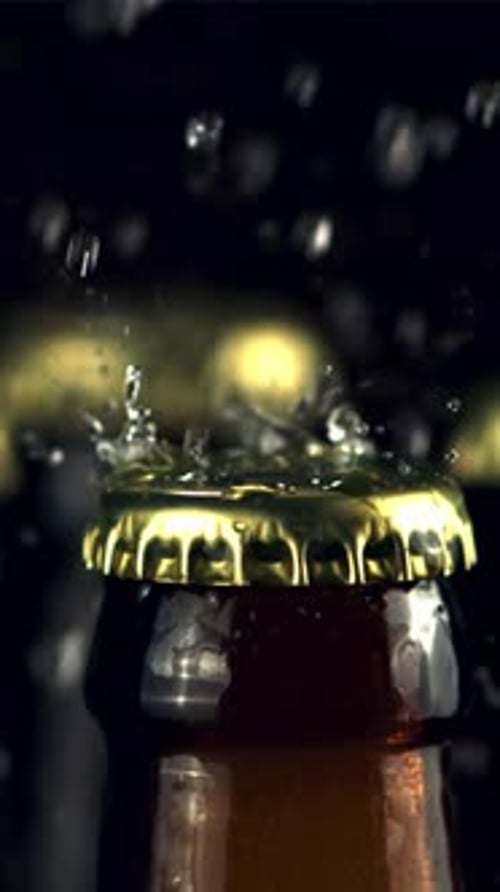 Super Slow Motion on Closed Beer Bottles Drops Water Filmed on a Highspeed Camera at 1000 Fps