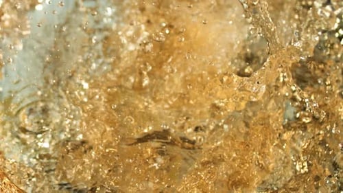 Beer Wave Curve Shape Inside a Glass In Slow Motion . Microbrewery Extreme Close-up. Slow-motion Col