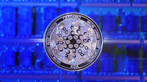 A Cardano ADA crypto currency coin hovering over a mining rig of computer chips and electric energy