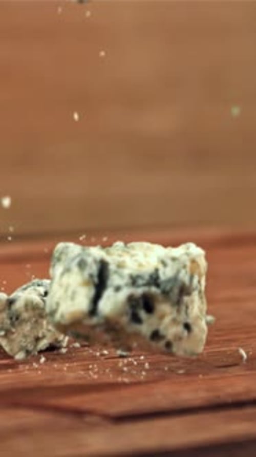 Super Slow Motion Blue Cheese Falls on a Wooden Table Filmed on a Highspeed Camera at 1000 Fps