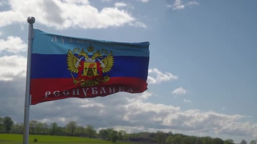 Luhansk People's Republic Flag Waving against Cloudy Sky