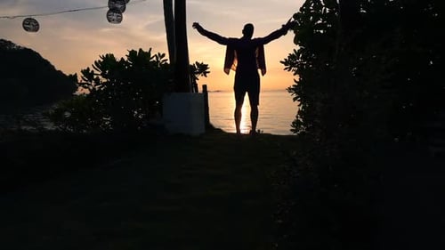 Man Admire View and Stretching Arms in Garden During Sunset, Super Slow
