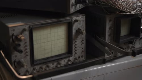 Scene Of Classic Electronics Laboratory Showcasing Aged Measurement Instruments And Bundled Cables