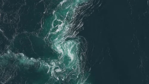 Powerful Tidal Currents Twist and Surge Into Foaming Whirlpools, Revealing the Raw Force of the Sea