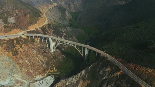 Bixby Bridge at famous Big Sur, Highway One in California with fog. Aerial