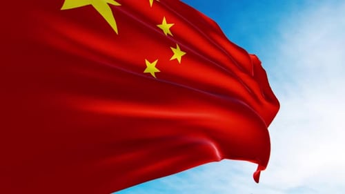 Realistic Waving Flag of China Against Blue Sky