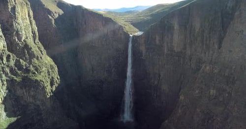Nature, travel and aerial of mountain with waterfall for natural environment