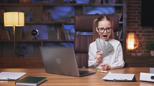 School Girl Playing with Money in Comfy Workplace
