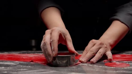 Chef Cuts Dough with Round Cookie Cutter