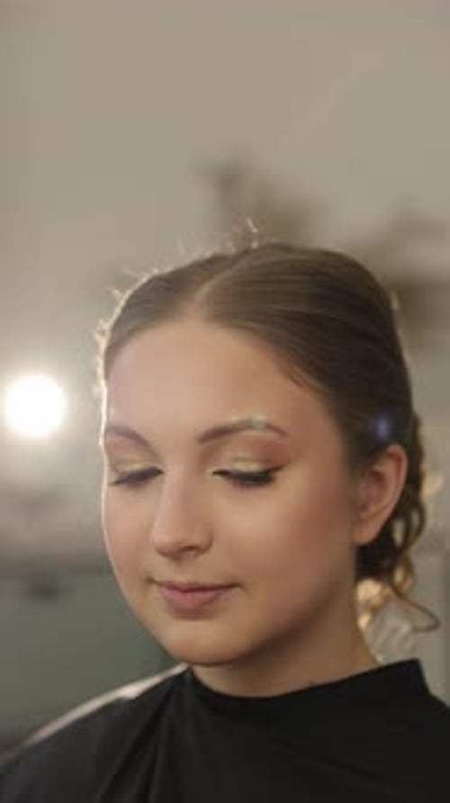 Young Woman Having Eye Makeup Applied