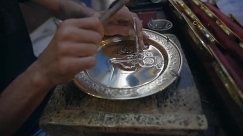 Craftsman Punches Out Pattern On Brass Plate At Marketplace Of Medina In Tunis, Tunisia. Closeup
