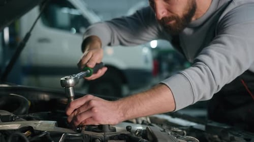 Caucasian Man Professional Auto Mechanic Repairman Service Worker Working in Automobile Station Male
