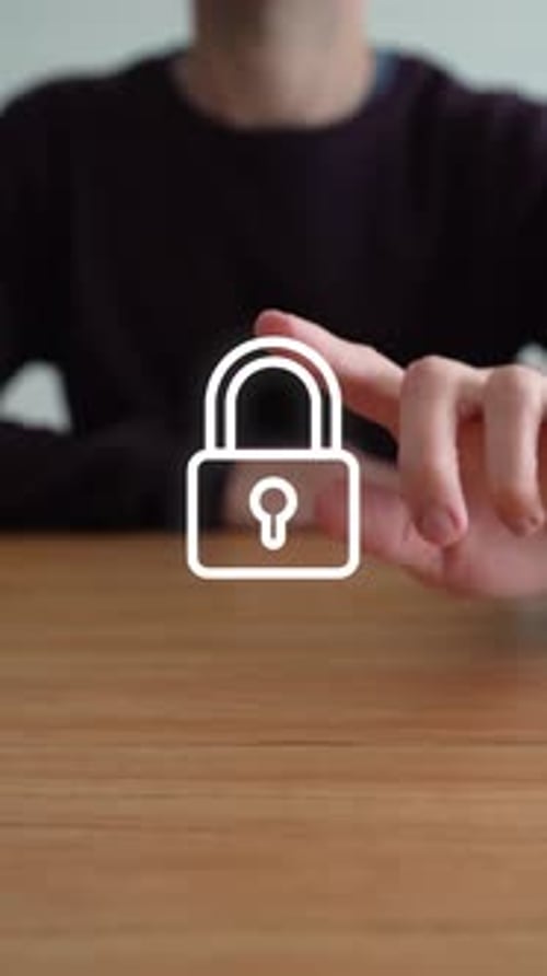 Person Touches Digital Padlock Icon Causing It To Disappear. Security Concept. vertical shot