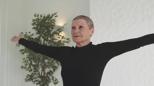 Woman Raising Arms in Slow Motion at Home