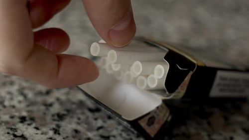 Hand Takes a Cigarette From an Open Pack Nicotine Addiction Stress Relief Bad Habit Heart Disease