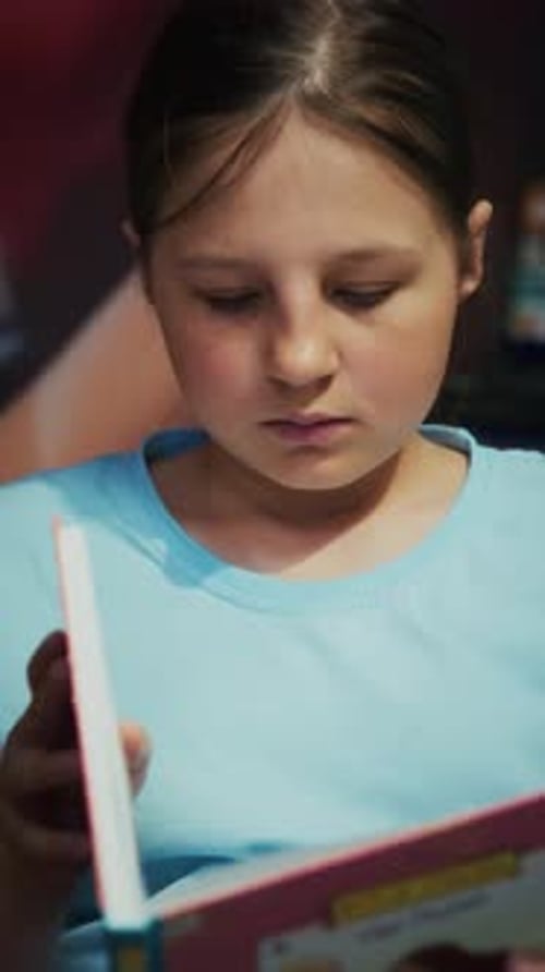 Girl Reads Book Indoors Close-Up Learning Literature