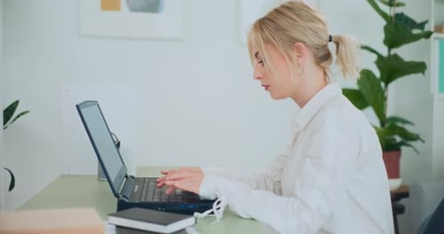 Businesswoman Writing Email to Client