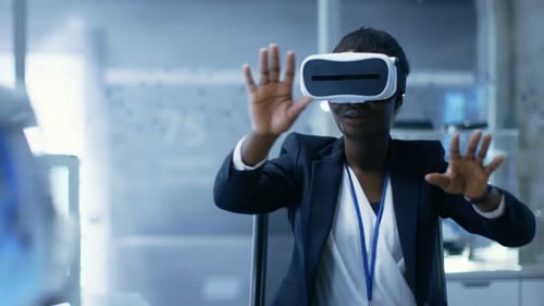 Woman Experiencing Virtual Reality in a Futuristic Workplace