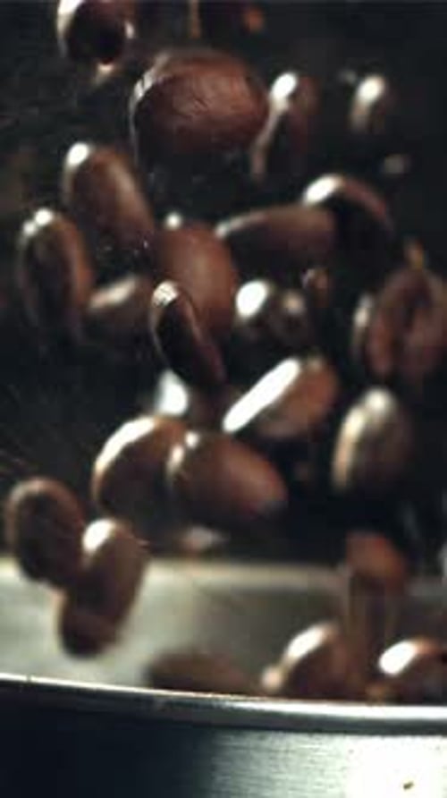 The Coffee Beans Fall Into the Working Grinder Filmed on a Highspeed Camera at 1000 Fps