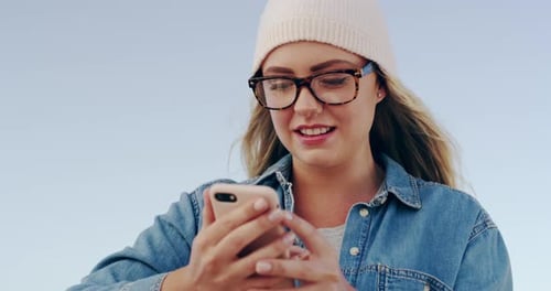 Young Woman Using Smartphone Outdoors