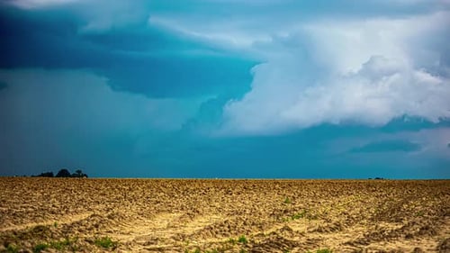 Timelapse of dramatic stormy cyclone clouds forming over countryside