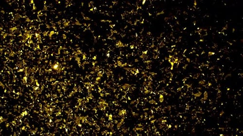 Golden Confetti Falling on Dark Background