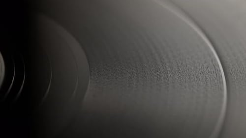 Rotating Black Vinyl Record Disk Macro Shot