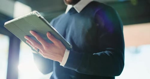 Hands, business and man with tablet in office for research, proofreading article and update draft