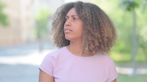 Woman Waiting and Checking Smartwatch Outdoors