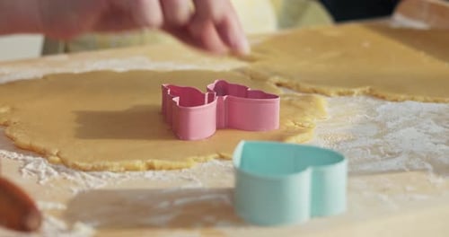 Close Up Shot Colorful Cookies Cutters on Wooden Surface