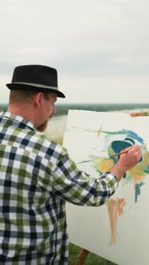Painter Working Outdoors on a Landscape Painting