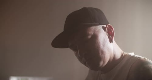 Artist Playing Bass Guitar in Music Studio